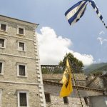 The two flags – of the Greek Democracy and the Orthodox Church – continuing Byzantine symbols.