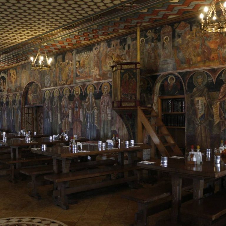 The tables used by the brothers of the Monastery and the pilgrims. In the center, the reader's stand is visible.