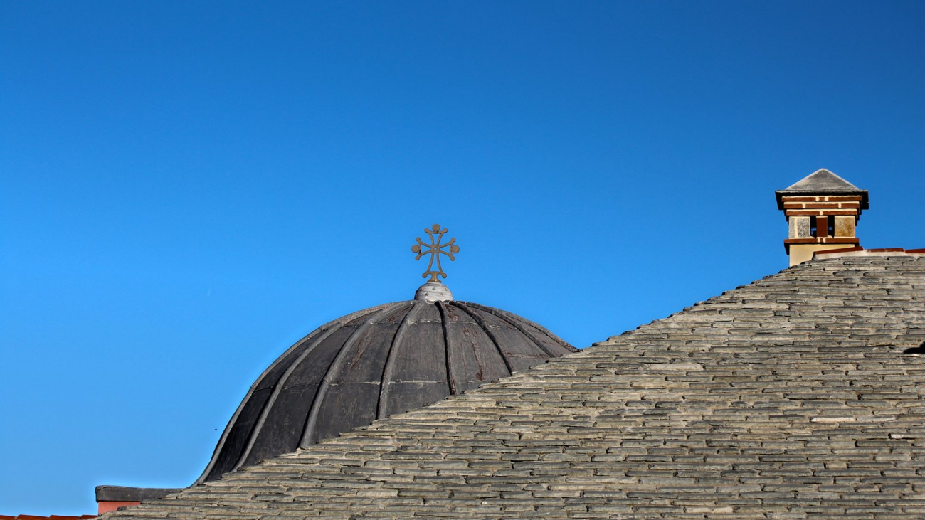 The cross dominates the roof, and is also a witness of faith.