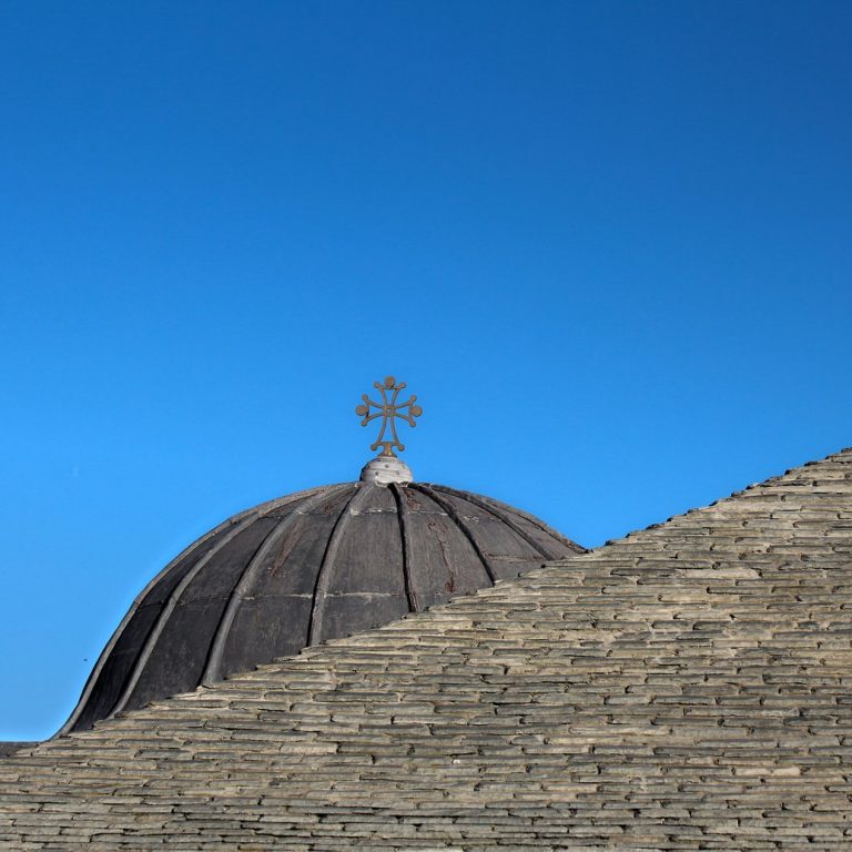 The cross dominates the roof, and is also a witness of faith.