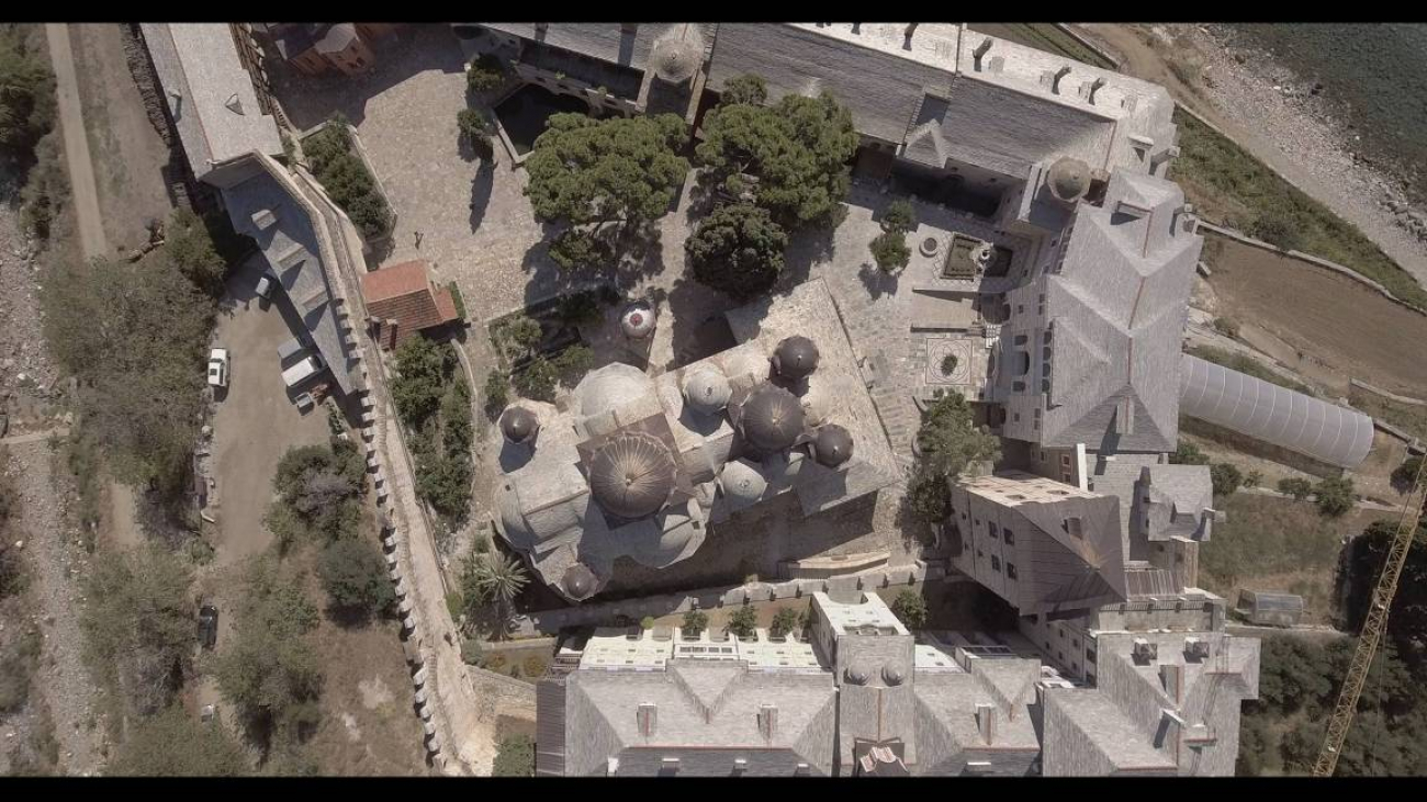 The bell tower, rather than a typical Athonite defensive tower, is the highest tower-shaped structure.