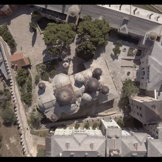 The bell tower, rather than a typical Athonite defensive tower, is the highest tower-shaped structure.