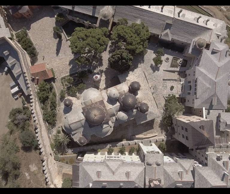 The bell tower, rather than a typical Athonite defensive tower, is the highest tower-shaped structure.