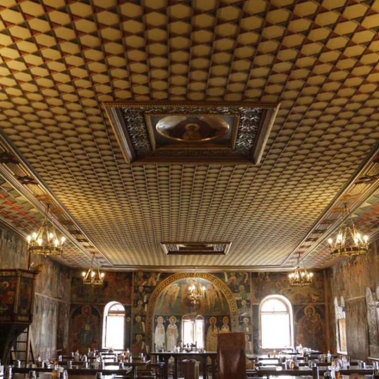 The refectory of the Xenofontos Monastery. Emphasis is given to the elaborate ceiling.