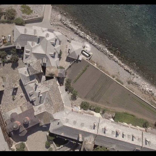 The uniform height of the buildings and the walls of the Monastery.