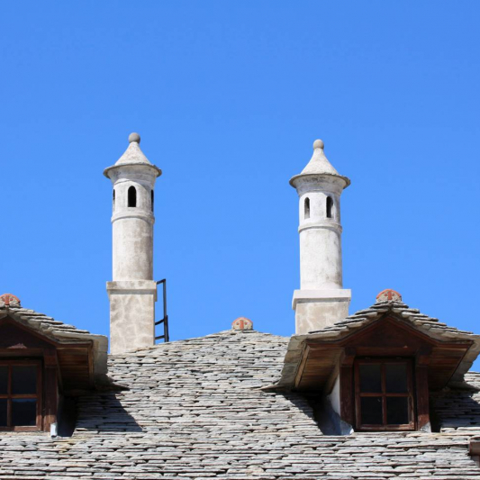 Traditional stlyed windows, roof and chimney.