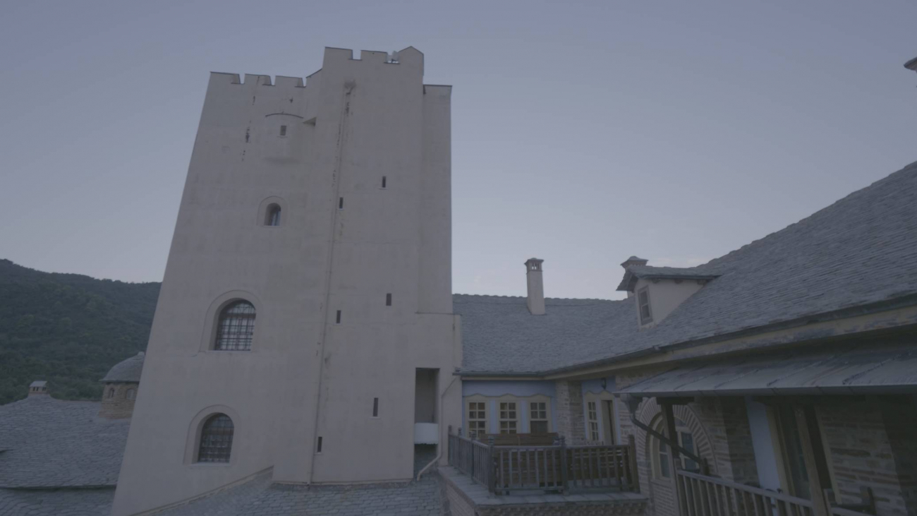 The tower stands out among the buildings in the compound