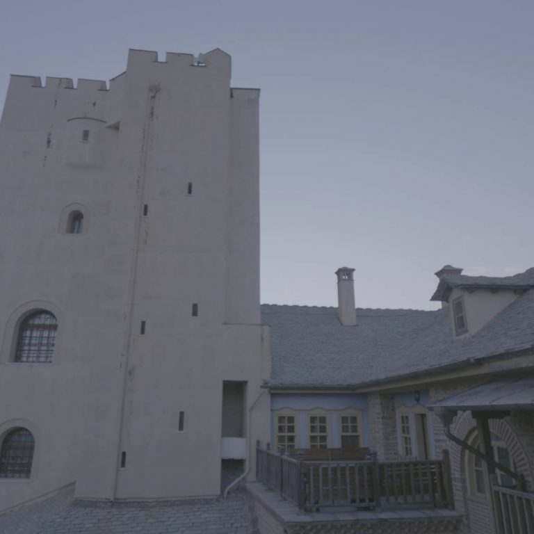 The tower stands out among the buildings in the compound