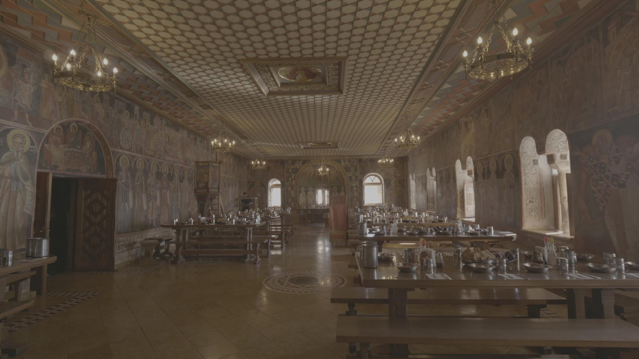 The refectory of the Monastery with its frescoes and the wooden roof of the Athonite architectural style.