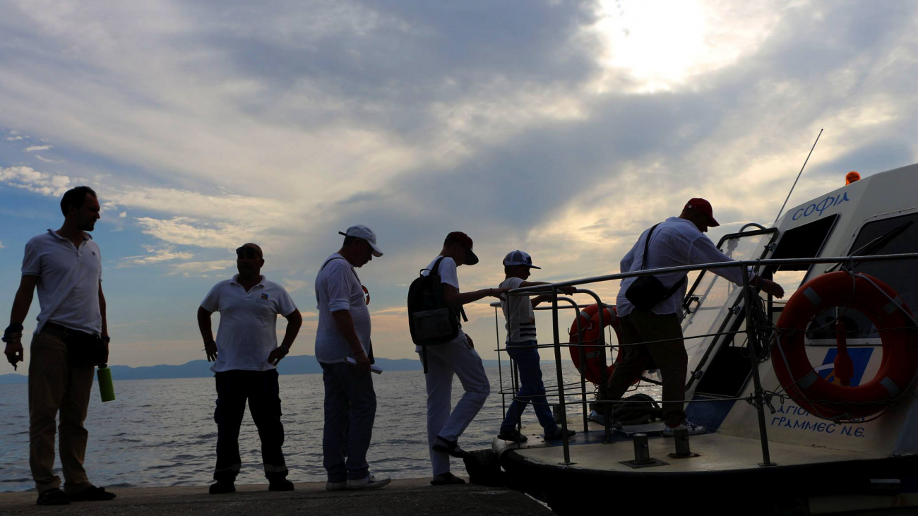 Pilgrims in the 'Arsenas' (shipyard) of the Monastery use the speedboat of the ferryline, that connects it to Ouranopolis and the other Monasteries.